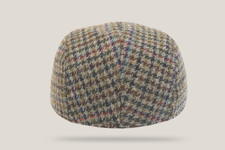 A classic Hills Hats flat cap in a brown, beige, and blue houndstooth pattern, shown from a three-quarters angle on a light gray background.